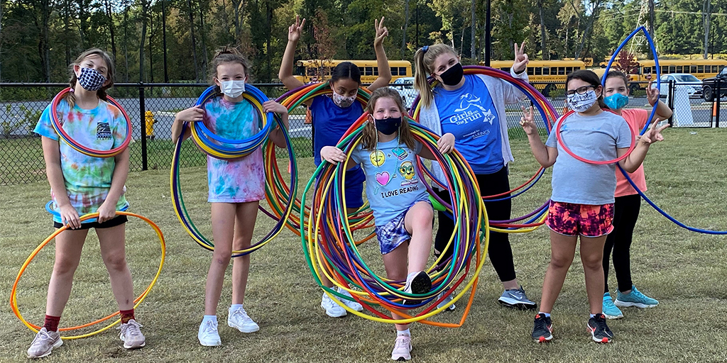 children outside|boy with strawberry|people on farm