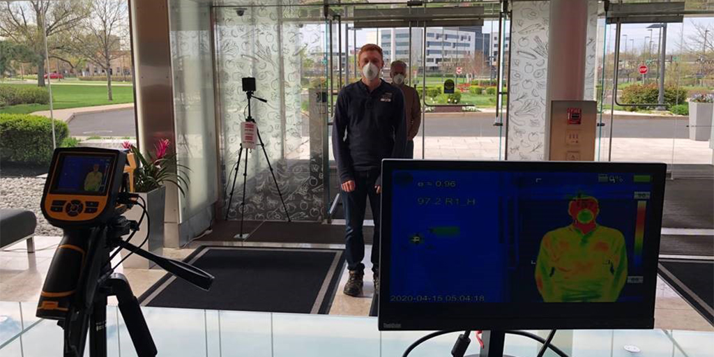 employee entering building with thermal scanner|employee at cape cod chip plant