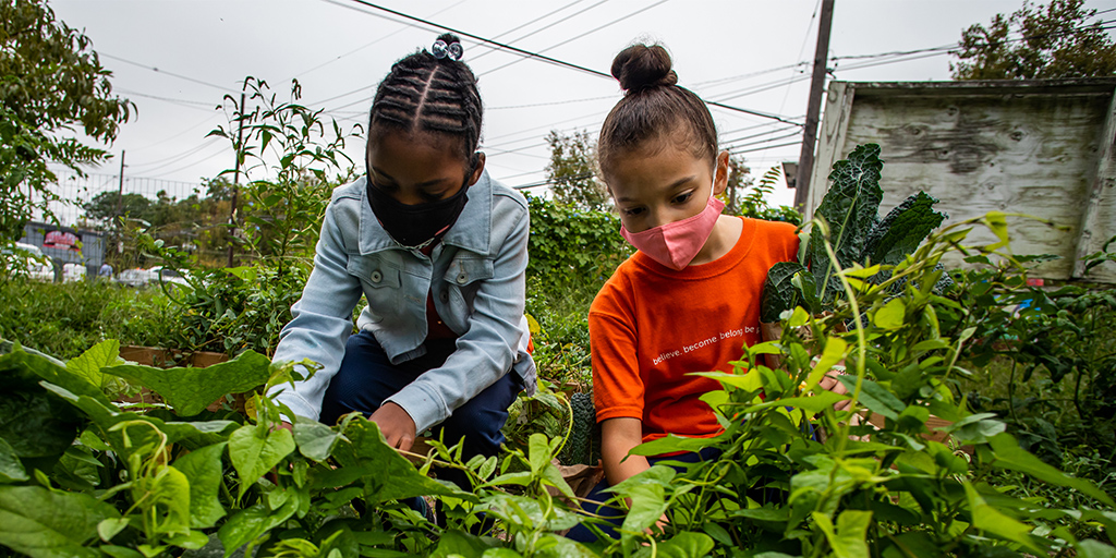 young girls gardening