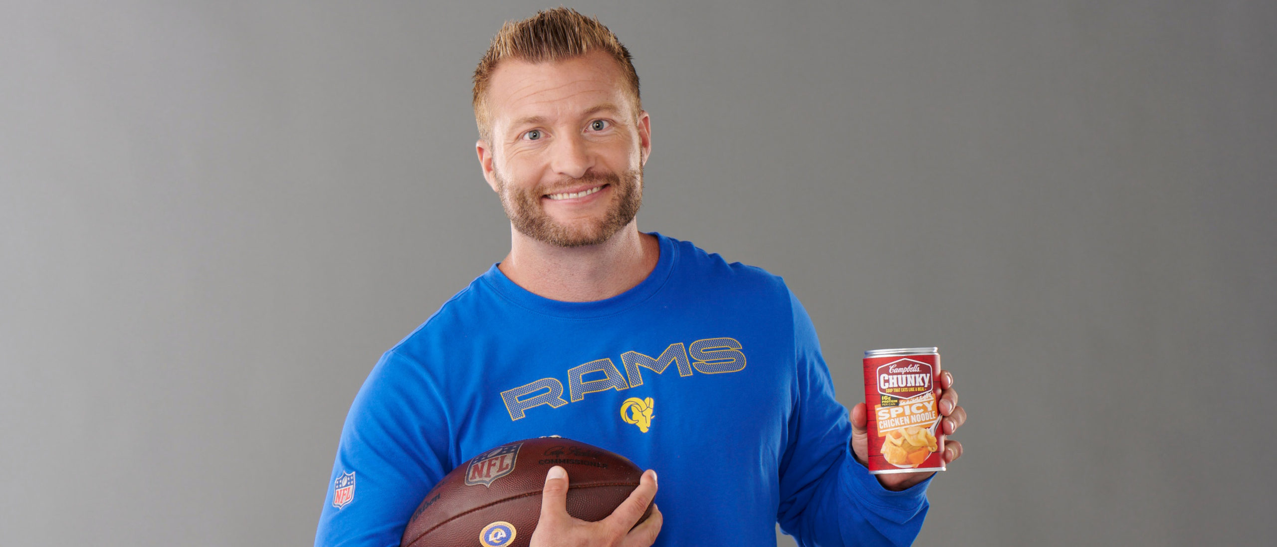 Coach Sean McVay holding Campbell's Chunky Spicy Chicken Noodle