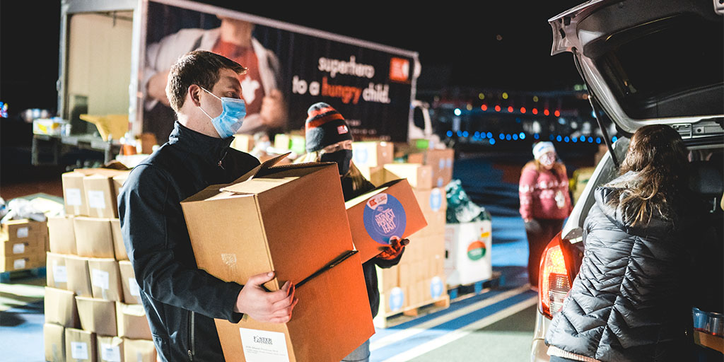 man holding food boxes