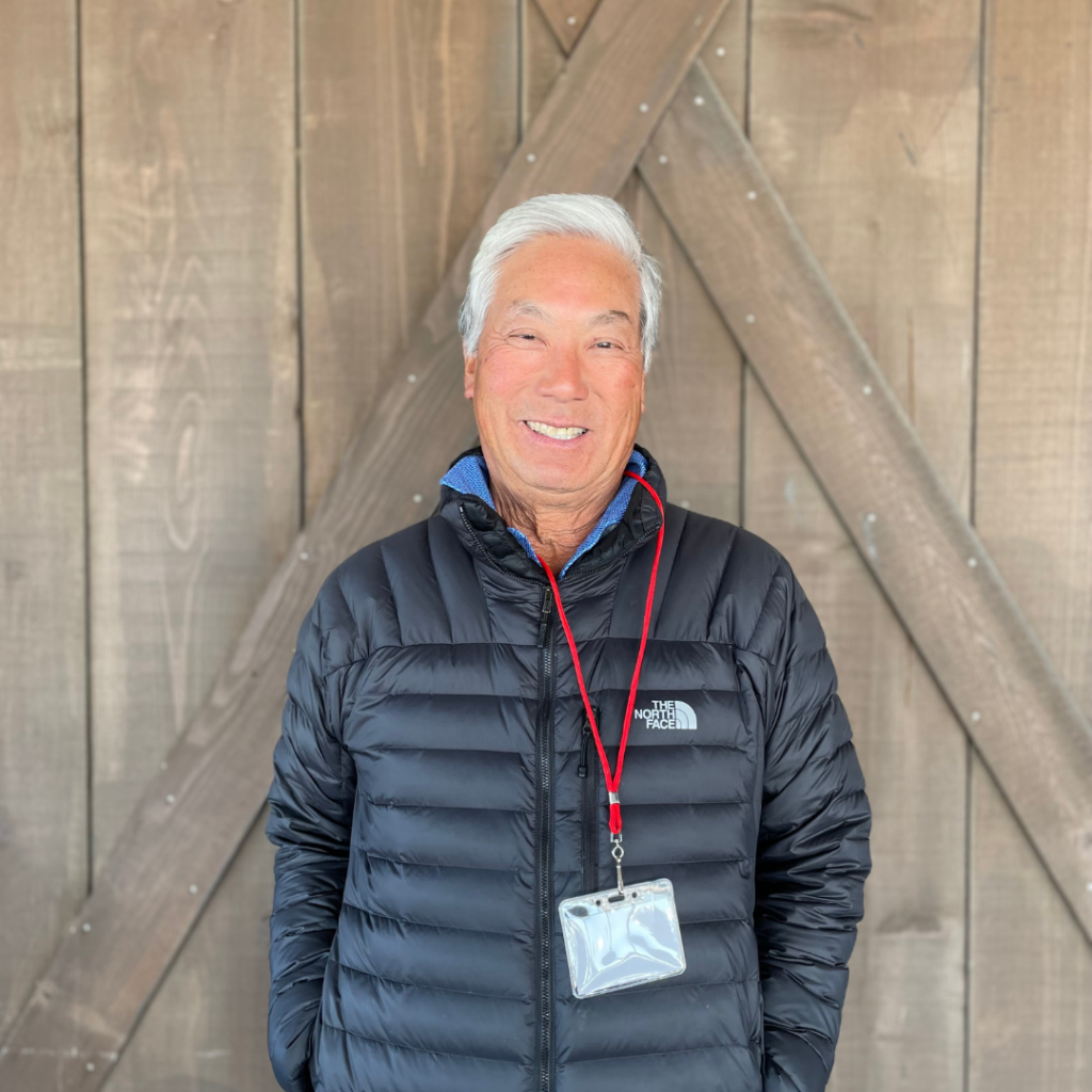 Ken Aoki poses by barn door