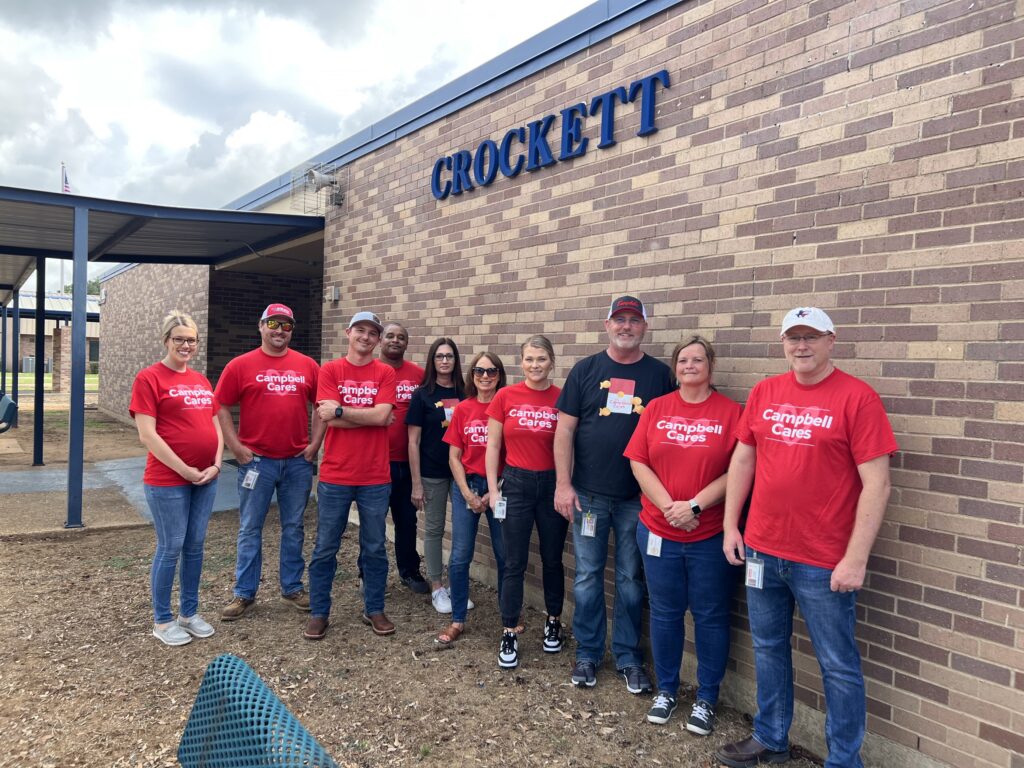 Campbell employees pose outside of Crockett Care Closet